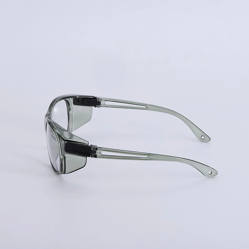 Side view of retro safety glasses showing translucent grey temple arms with black hinges and wraparound side shield design - impact-resistant protective eyewear for chemical splash and debris protection Side view of retro safety glasses showing translucent grey temple arms with black hinges and wraparound side shield design - impact-resistant protective eyewear for chemical splash and debris protection